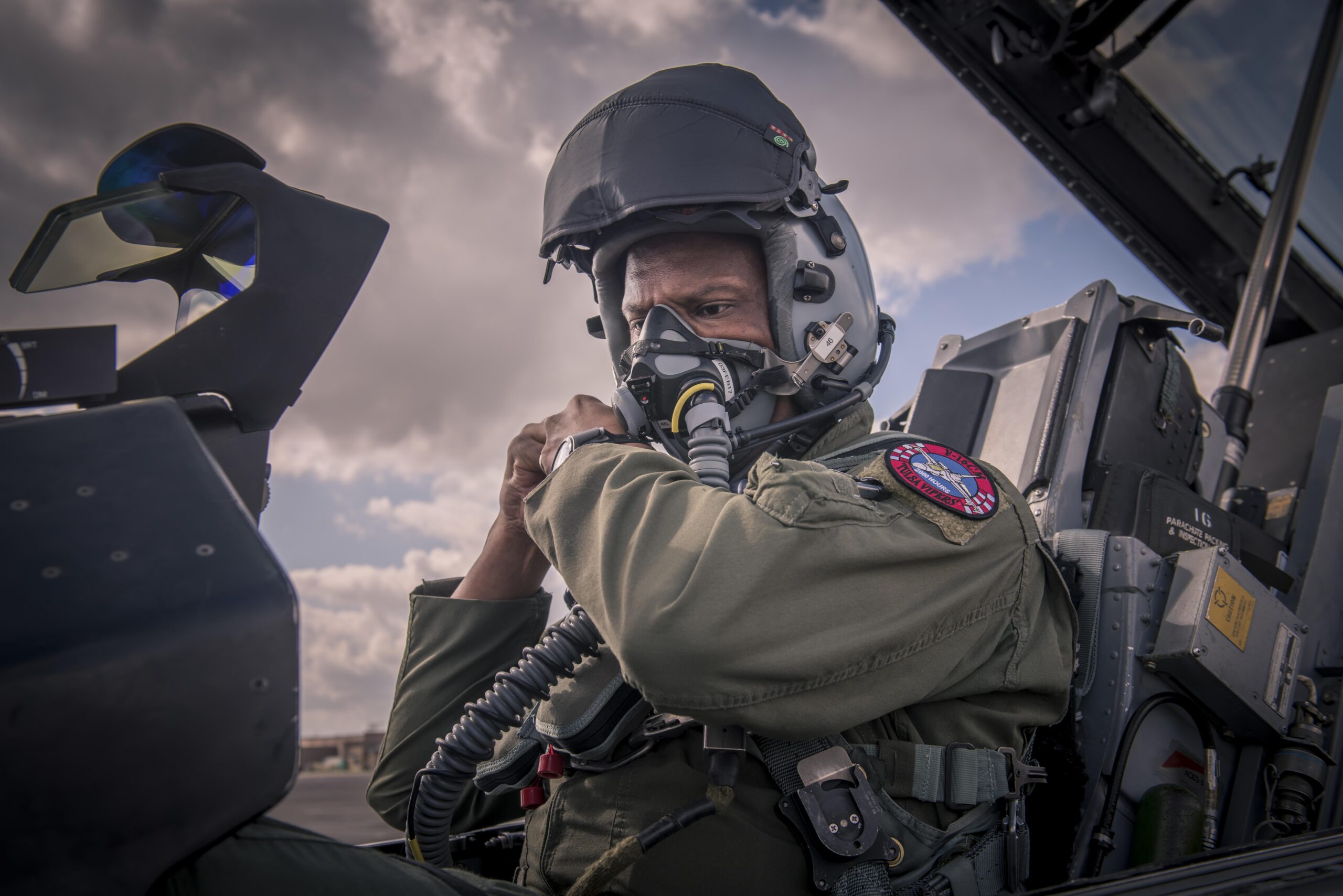 Fighter pilot seated in an aircraft cockpit