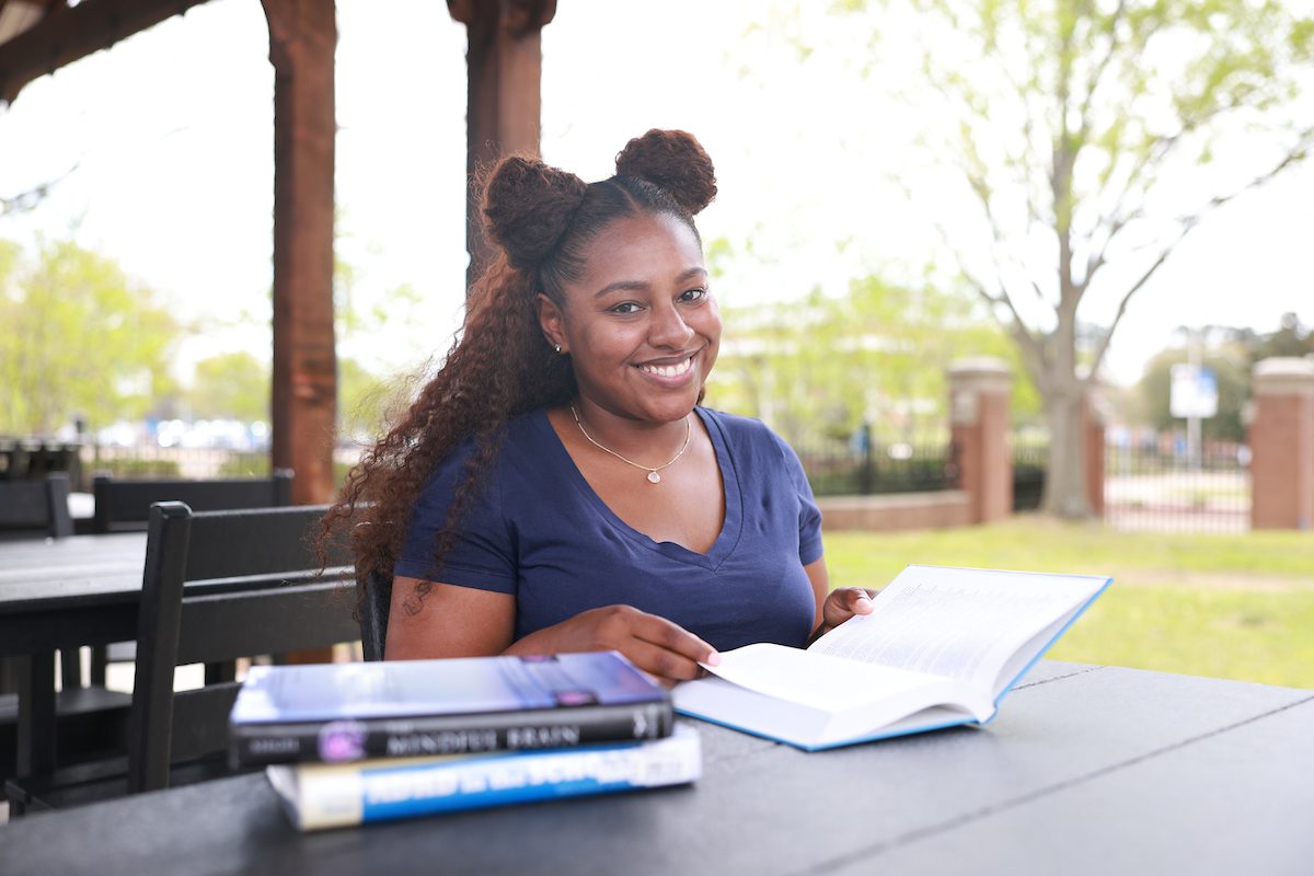 JSU student reading books