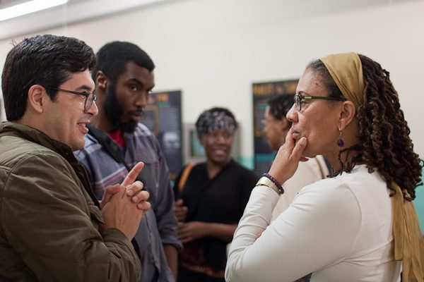 Photo of Dr. Barnes talking with faculty and students after the 2nd Murder, Mayhem and Lynching Lecture